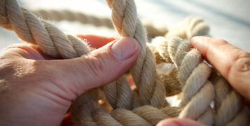 Natural,Hemp,Rope,Being,Knotted,By,A,Sailor/fisherman,,Close,Up